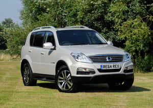 Sleek Ssangyong Luxury Suv In Motion Wallpaper