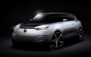 Sleek Ssangyong Suv Cruising On A Scenic Road Wallpaper