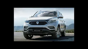 Sleek Ssangyong Suv Cruising On Scenic Road Wallpaper