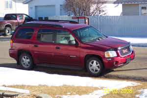Sleek, Stunning Gmc Envoy On An Open Road Wallpaper