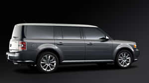 Sleek & Stylish Ford Flex Cruising On The Road Wallpaper