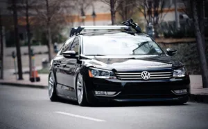 Sleek Volkswagen Passat Cc Cruising On Open Road Wallpaper