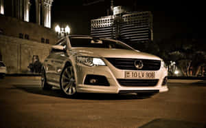 Sleek Volkswagen Passat Cc In Motion Wallpaper