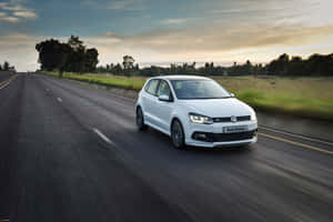 Sleek Volkswagen Polo In Dynamic Action Wallpaper