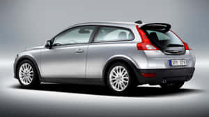 Sleek Volvo C30 In Motion Wallpaper