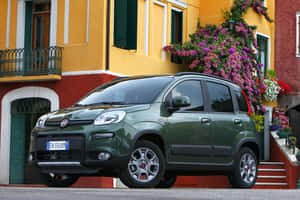 Sleek White Fiat Panda In Scenic Terrain Wallpaper