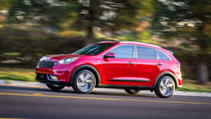 Sleek White Kia Niro In Nature Wallpaper