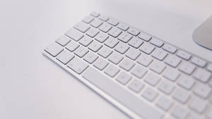 Sleek White Wireless Mac Keyboard Wallpaper