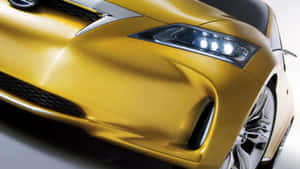 Sleek Yellow Car In Action Wallpaper