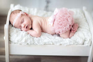 Sleeping Newbornin Pink Tutu Wallpaper