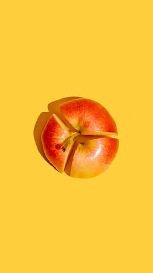 Sliced Apple Yellow Background Wallpaper