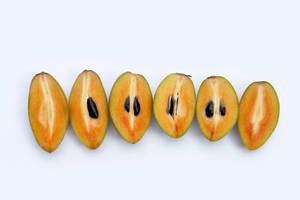 Sliced Sapodilla Fruits Wallpaper