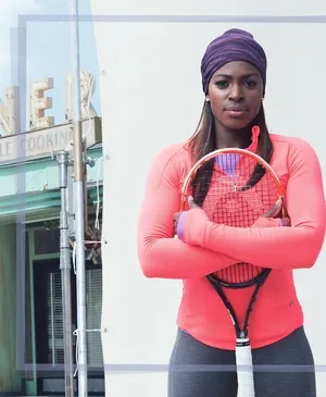 Sloane Stephens Hugging A Rakcet Wallpaper