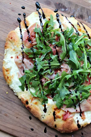Small Pizza With Meat And Arugula Wallpaper