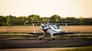 Small Plane On The Runway Wallpaper