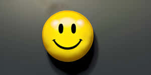 Smiley Face Pin On Gray Background.jpg Wallpaper