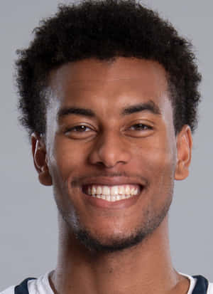 Smiling Athlete Headshot Wallpaper