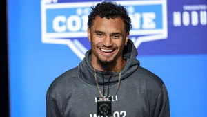 Smiling Athlete Press Conference Wallpaper