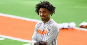 Smiling Athleteat Training Facility Wallpaper