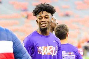 Smiling Athletein Purple Jersey Wallpaper