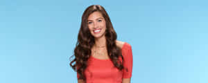 Smiling Bachelorette Contestant Blue Background Wallpaper