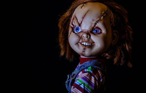 Smiling Chucky With Scar Stitches Wallpaper