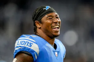 Smiling Football Player Detroit Lions Uniform Wallpaper