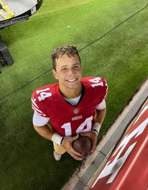 Smiling Football Player Number14 Wallpaper