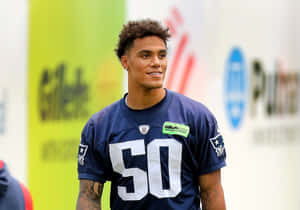 Smiling Football Player Number50 Wallpaper