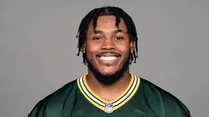 Smiling Football Player Portrait Wallpaper