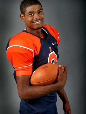 Smiling Football Player Portrait Wallpaper