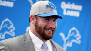 Smiling Frank Ragnow In Formal Attire Wallpaper