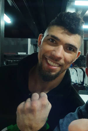 Smiling Johnny Walker Showing Clenched Fist Wallpaper