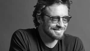 Smiling Man Blackand White Portrait Wallpaper