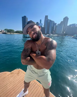 Smiling Man City Waterfront Backdrop Wallpaper