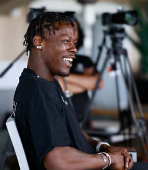 Smiling Man During Interview Wallpaper