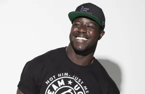 Smiling Manin Black T Shirtand Cap Wallpaper