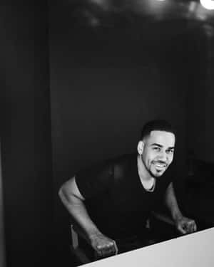 Smiling Manin Blackand White Wallpaper