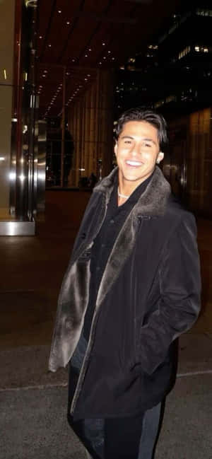 Smiling Manin Evening Cityscape Wallpaper