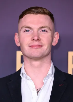 Smiling Manin Suitat Event Wallpaper