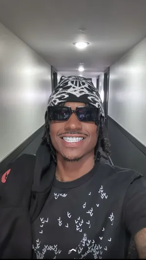 Smiling Manwith Sunglassesand Beanie Wallpaper