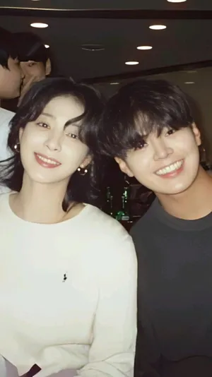 Smiling Pair Indoor Event Wallpaper