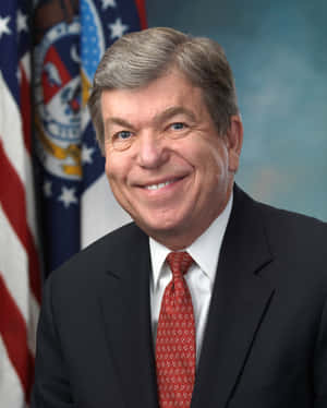 Smiling Roy Blunt Formal Shot Wallpaper