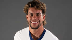 Smiling Soccer Player Portrait Wallpaper