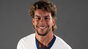 Smiling Soccer Player Portrait Wallpaper