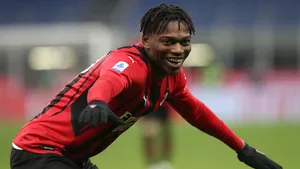 Smiling Soccer Playerin Action Wallpaper