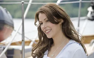 Smiling Woman On Boat Deck Wallpaper