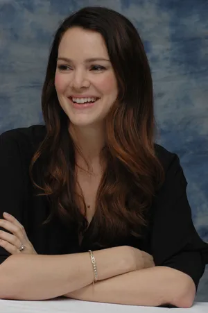 Smiling Womanin Black Blouse Wallpaper