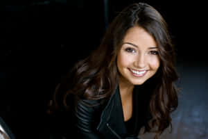 Smiling Womanin Black Leather Jacket Wallpaper