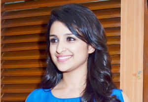 Smiling Womanin Blue Top Wallpaper